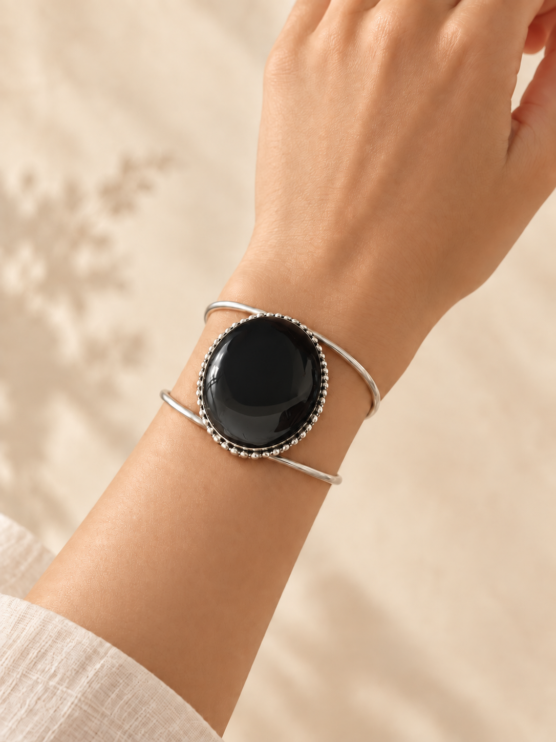 Cuff 14 — Black Braid Edge — hand try-on