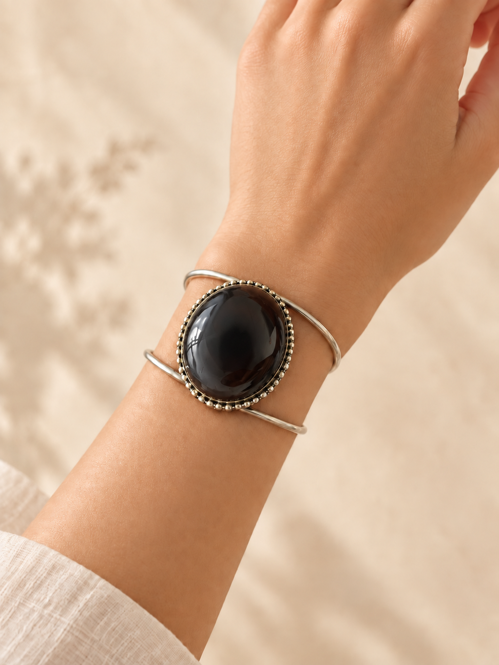 Cuff 18 — Black Gold Bead Edge — hand try-on