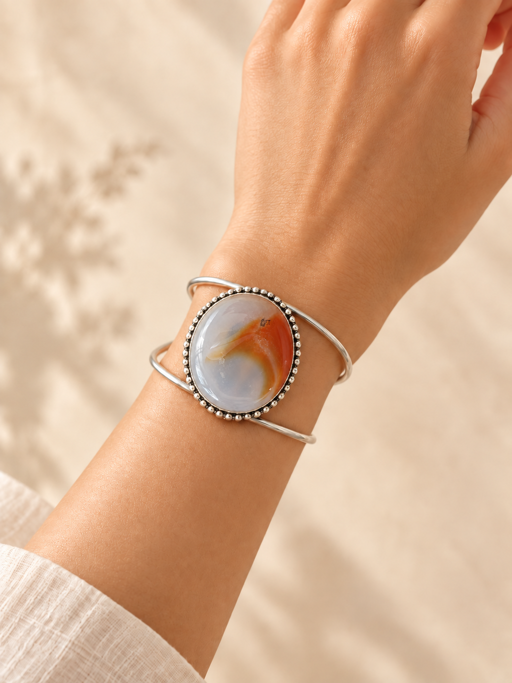 Cuff 19 — Pale Red Bead Edge — hand try-on