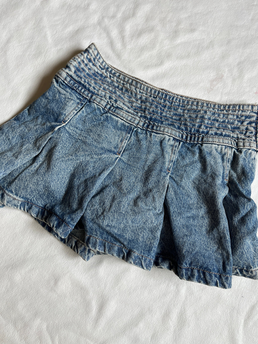 pleated denim skirt