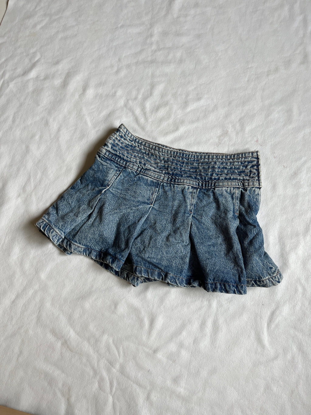 pleated denim skirt